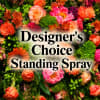 A lush, layered standing spray designed to convey heartfelt sympathy with a