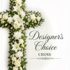 A graceful upright cross crafted in serene whites and deep greens, arranged