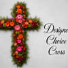 A vivid cross-shaped sympathy arrangement that balances reverence with joyful remembrance for