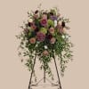 Soft blush and mauve tones mingle with deep burgundy and fresh green