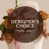 Mixed flower arranged around a kraft bag make this small floral carrier