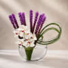 A striking contemporary floral design featuring elegant white cymbidium orchids paired with