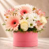 Pink and white mixed bouquet in a round pink box