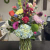 Celebrate a remarkable milestone with 50 stunning blooms thoughtfully arranged to honor