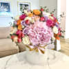 Mixed roses and hydrangeas in a white hatbox with a ribbon