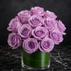 Lavender rose bouquet in a clear glass vase