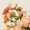 A free‑flowing designer&rsquo;s choice arrangement, artfully gathered with mixed blooms and lush