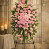 A full, oval composition of pink roses, lilies, carnations, and snapdragons, Blushing