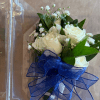 White rose bouquet with baby's breath and a blue ribbon