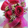 Small pink rose bouquet with ribbon and tiny white filler flowers