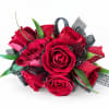 Red rose bouquet with black ribbon accents on a white background