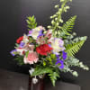A colorful, romantic flower arrangement built to make someone feel truly seen
