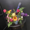 Bright, garden-fresh and bursting with color, this mixed-color bouquet pairs sunny sunflowers