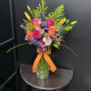 A bright, garden-style bouquet that feels like a warm evening glow-perfect as