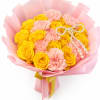 Yellow roses and pink carnations wrapped in pink paper with pearl accents