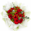 Bouquet of red roses wrapped in white paper
