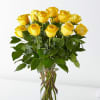 Yellow roses arranged in a clear glass vase