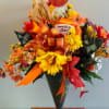 Autumn bouquet with yellow and orange flowers in a black cone wrap