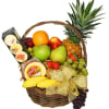 Fruit basket with pineapple, apples, grapes, strawberries, bananas, and cheese