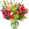 Colorful mixed bouquet in a clear glass vase