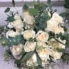 Elegant Bridal Bouquet with fresh Roses and a variety of Eucalyptus.