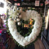 Thoughtfully designed to convey heartfelt sympathy, this all-white arrangement symbolizes peace, purity