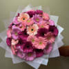 Bright, cheerful, and full of charm, this handmade bouquet is designed to