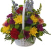 Colorful mixed flower basket with a white handle