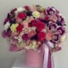 Pink and purple mixed bouquet in a pink hat box with ribbon
