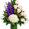 Pink roses and purple flowers in a green glass vase with white hydrangea