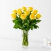 Yellow roses arranged in a clear glass vase
