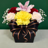 Mixed bouquet in a black gift box with a ribbon bow