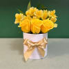 Yellow roses and yellow alstroemeria in a white round box with a gold ribbon