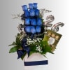 Blue roses in a gift box with Ferrero Rocher chocolates and silver number balloons.