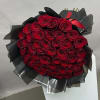 Large bouquet of red roses wrapped in black paper