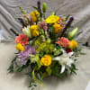 Colorful mixed flower basket with roses, lilies, and gerbera daisies