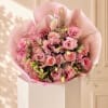 Pink rose bouquet wrapped in pale pink paper