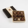 Box of assorted chocolates in an open gift box
