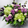 Bouquet of green hydrangeas, purple daisies, and white roses