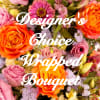 Mixed bouquet with orange and pink roses and purple filler flowers