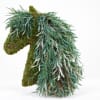 Moss-covered horse sculpture draped with cascading greenery