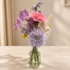 Mixed pastel bouquet in a clear glass vase