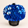 Blue rose bouquet with light blue orchids in a black hatbox