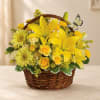 Yellow floral basket with lilies, roses, and daisies