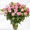 Pink roses arranged in a clear glass vase