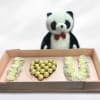 Gift box with white rose letters and a teddy bear holding chocolates