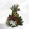 Tropical floral arrangement with sunflowers, red roses, and white lilies