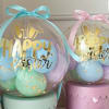 Clear balloons with pastel balloons and gold "Happy Easter" lettering