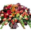 Mixed bouquet of roses, gerbera daisies, and lilies in warm colors