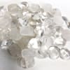 Pile of clear polished stones on a white surface
